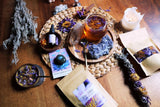  BLUE LOTUS | table arrangement with teas, elixirs, petals and whole flowers of blue lotus